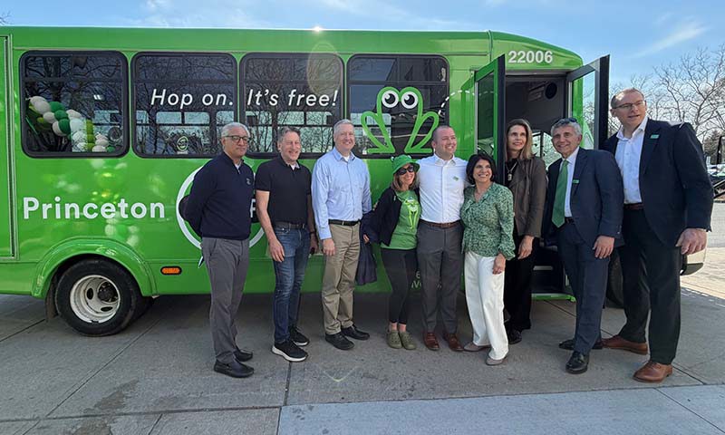Attendees in front of a Princeton loop bus